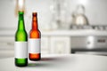 Beer bottles with blank label mock-up in kitchen interior Royalty Free Stock Photo