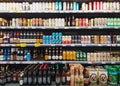 Beer in bottles and cans on grocery store shelves Royalty Free Stock Photo