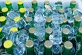 Beer Bottles in Ice Cubes, Many Cold Bottle Caps in Box, Iced Chilled Beer Chest, Different Cold Bottles Royalty Free Stock Photo