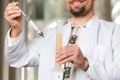 Beer brewer in his brewery examining