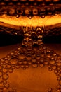 beer bubbles while beer being poured into beer goblet in a bar Royalty Free Stock Photo