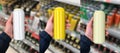 Beer can in hand. Mockup in front of shelf at hypermarket