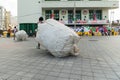 Beer can pickers are seen carrying huge bags after Carnival night