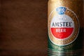 Beer can with water drops. AMSTEL beer in a can close-up covered with condensation water. World famous Dutch brand. Dark textured Royalty Free Stock Photo