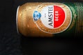 Beer can with water drops. AMSTEL beer in a can covered with condensation. World famous Dutch brand. Black wet background with Royalty Free Stock Photo