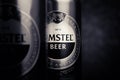 Beer cans. AMSTEL beer in cans close-up. A number of cans on a brown background. An internationally renowned brand from the Royalty Free Stock Photo