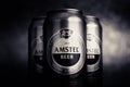 Beer cans. AMSTEL beer in cans close-up. A row of cans on a brown background. The world-famous brand in the Netherlands. Selective Royalty Free Stock Photo