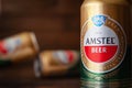 Beer cans. AMSTEL beer in cans close-up. World famous Dutch brand. Blurred wood background. Kiev. Ukraine. June-26.2021 Royalty Free Stock Photo