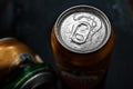 Beer cans. Wet crumpled and full beer cans with condensation drops on a dark background, top view. AMSTEL is a world famous brand