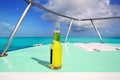 Beer on Caribbean boat bow deck turquoise sea