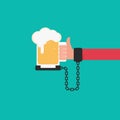 Beer chained to handcuff in hand. Alcoholism concept.