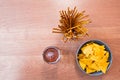 Beer, chips and breadsticks on a table from above Royalty Free Stock Photo