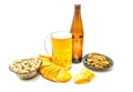 Beer, chips, crackers and pistachios Royalty Free Stock Photo