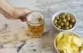 Beer with chips and olives Royalty Free Stock Photo