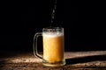 Beer. Cold Craft light Beer in a glass with water drops on the wooden table over the black background Royalty Free Stock Photo