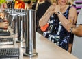 Beer cranes on the street and people formed a line. Royalty Free Stock Photo