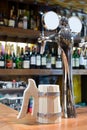 Beer faucet with a mug in a bar Royalty Free Stock Photo