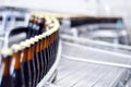 Beer filling in a brewery - conveyor belt with glass bottles Royalty Free Stock Photo