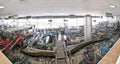 Beer filling in a brewery - conveyor belt with glass bottles Royalty Free Stock Photo