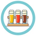 Beer flight with three different colored brews in a teal circle Royalty Free Stock Photo