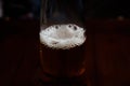 Beer foam in a bottle on a dark background Royalty Free Stock Photo