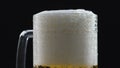 Beer foam flowing down glass walls, soft drink, pasteurized and filtered brew