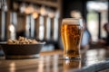 Beer in a glass on a bar counter with blurry background, generative AI Royalty Free Stock Photo