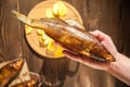 Beer glass with beer and hot smoked fish close-up. Beer mug with beer and potato chips, crackers on a dark background and copy spa Royalty Free Stock Photo