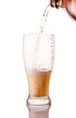 beer glass being poured from bottle isolated on white background Royalty Free Stock Photo