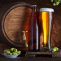 Beer glass and bottle with barrel