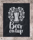 Beer glass drawing chalk on board in wooden frame