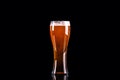 Beer glass with foam on black background Royalty Free Stock Photo