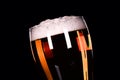 Beer glass with foam on black background Royalty Free Stock Photo