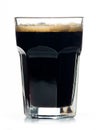 Beer glass full of cold black irish stout. Royalty Free Stock Photo