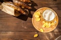 Beer glass with beer and hot smoked fish close-up. Beer mug with beer and potato chips, crackers on a dark background and copy spa Royalty Free Stock Photo