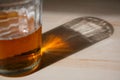 beer glass and reflection on table Royalty Free Stock Photo