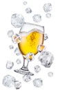 Beer glass surrounded with flying ice cubes. Conceptual picture of beer glass chilling