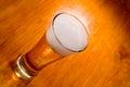 Beer glass on wood background Royalty Free Stock Photo