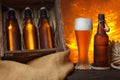 Beer glass with wooden crate full of beer Royalty Free Stock Photo