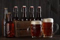 Beer glasses on table with crate full of bottles Royalty Free Stock Photo