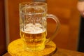 Beer golden hop drunk half glass white foam close-up pub a refreshing drink Royalty Free Stock Photo