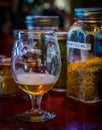 Glass of beer beside its ingredients Royalty Free Stock Photo