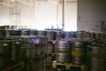 Beer kegs. many metal beer keg stand in rows in a warehouse Royalty Free Stock Photo