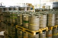 Beer kegs. many metal beer keg stand in rows in a warehouse Royalty Free Stock Photo