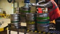 Beer kegs. many metal beer keg stand in rows in a warehouse Royalty Free Stock Photo