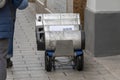 beer kegs are transported on a cart to a bar or restaurant.