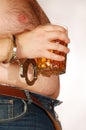 Beer on male belly Royalty Free Stock Photo