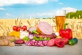 Beer, meat snacks, vegetables products in field Royalty Free Stock Photo