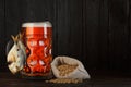 Beer mug beer with smoked salty fish, barley bag Royalty Free Stock Photo