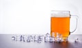 Beer mug and Fresh Beer with foam and ice cube Royalty Free Stock Photo